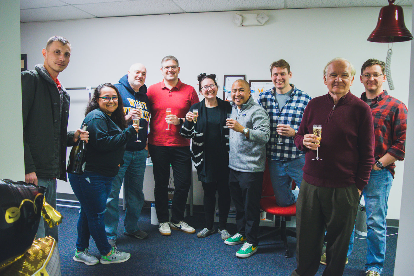 Members of the January 2024 class celebrating together in the academy classroom